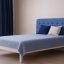 Белая кровать Калифорния 140x200 из бука с мягкой спинкой синего цвета